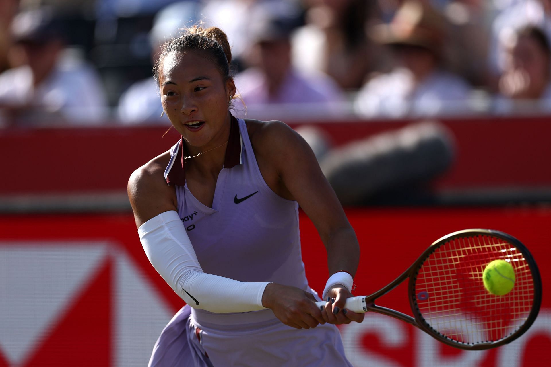 World No. 6 Qinwen hits a backhand at Queen's Club | Image Source: Getty